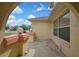 A cozy front porch featuring decorative globe lights and stone accents creates a welcoming entrance at 10412 Ireland St, Spring Hill, FL 34608