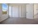 Bright bedroom with a closet, and a view of the neighborhood from the window at 11594 Oak Ln, Largo, FL 33778