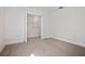 Carpeted bedroom with a closet and natural lighting at 11594 Oak Ln, Largo, FL 33778
