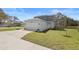 Charming two-story home with a paved driveway, attached garage, and well-manicured lawn at 11594 Oak Ln, Largo, FL 33778