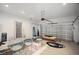 Spacious garage with a roll-up door and ample storage space, ready for customization at 11594 Oak Ln, Largo, FL 33778