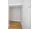 Small closet/storage area with wood laminate flooring at 11594 Oak Ln, Largo, FL 33778