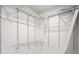 Walk-in closet featuring a white metal shelving system, maximizing storage at 11594 Oak Ln, Largo, FL 33778