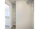Organized walk-in closet adjacent to a bathroom with installed metal shelving at 11594 Oak Ln, Largo, FL 33778