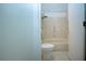 Clean bathroom with tile shower and built-in grab bars at 609 Fort Duquesna Dr, Sun City Center, FL 33573
