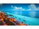 Expansive beach view of Clearwater Beach, Florida showcasing the ocean, palm trees, and sandy coastline at 609 Fort Duquesna Dr, Sun City Center, FL 33573