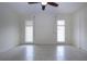 Bright bedroom features shuttered windows, ceiling fan and tile flooring at 609 Fort Duquesna Dr, Sun City Center, FL 33573