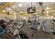 Bright, spacious community fitness center featuring modern exercise equipment and several large screen televisions at 609 Fort Duquesna Dr, Sun City Center, FL 33573