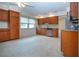 Bright kitchen with wood cabinets, tile flooring, and modern appliances at 609 Fort Duquesna Dr, Sun City Center, FL 33573