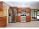 Updated kitchen with stainless steel appliances, wooden cabinets, and tile floors at 609 Fort Duquesna Dr, Sun City Center, FL 33573