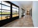 Extended lanai with large windows providing views of the pond at 609 Fort Duquesna Dr, Sun City Center, FL 33573