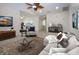 Cozy living room featuring stylish decor, comfortable seating, and a modern rug at 609 Fort Duquesna Dr, Sun City Center, FL 33573