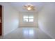 Bright, open living room with neutral tile flooring, a ceiling fan and natural light from a window at 609 Fort Duquesna Dr, Sun City Center, FL 33573