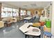 Spacious studio with pottery wheels, tables, and natural light, creating an inspiring environment for artistic endeavors at 609 Fort Duquesna Dr, Sun City Center, FL 33573