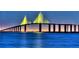 Scenic view of the Sunshine Skyway Bridge at night, illuminating the vibrant structure over the tranquil water at 609 Fort Duquesna Dr, Sun City Center, FL 33573