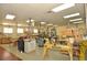 Spacious workshop featuring worktables, cabinets, and professional woodworking equipment for creative projects at 609 Fort Duquesna Dr, Sun City Center, FL 33573