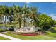 Waterlefe Golf & River Club entrance with lush landscaping and clear blue skies at 10626 Restoration Ter, Bradenton, FL 34212