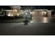 Well-maintained home with three-car garage, paver driveway, and manicured front lawn at 10626 Restoration Ter, Bradenton, FL 34212