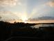 Stunning sunset view over the lake from the property at 10626 Restoration Ter, Bradenton, FL 34212