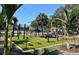 Outdoor fitness center with various exercise machines and manicured artificial turf at 3909 W Eden Roc Cir, Tampa, FL 33634