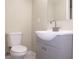 Charming bathroom featuring new vanity and a standard toilet at 7160 Lenape Cir, New Port Richey, FL 34653