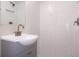 Modern bathroom featuring white subway tiles in the shower with a gray vanity and sleek fixtures at 7160 Lenape Cir, New Port Richey, FL 34653