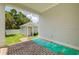 Backyard view featuring a separate in-law suite with brick pathway at 100 37Th Ne Ave, St Petersburg, FL 33704