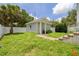 Backyard view of separate in-law suite and landscaped yard at 100 37Th Ne Ave, St Petersburg, FL 33704