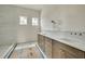Bathroom featuring a double vanity with marble countertops and stylish fixtures at 100 37Th Ne Ave, St Petersburg, FL 33704