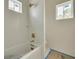 Bathroom featuring a tub with white subway tile surround at 100 37Th Ne Ave, St Petersburg, FL 33704