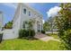 Two-story home with lush lawn and mature landscaping at 100 37Th Ne Ave, St Petersburg, FL 33704