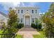 Charming two-story home features a welcoming entrance with brick steps and beautifully maintained landscaping at 100 37Th Ne Ave, St Petersburg, FL 33704