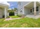 Exterior view featuring in-law suite, covered porch, and landscaped yard at 100 37Th Ne Ave, St Petersburg, FL 33704