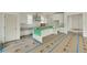 Bright, modern kitchen with white cabinets and a center island, ready for personalization at 100 37Th Ne Ave, St Petersburg, FL 33704