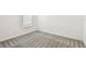 Clean and inviting bedroom with soft carpeting and a window providing natural light at 12811 Wanderlust Pl, Parrish, FL 34219