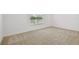 Bright bedroom features a large window at 12811 Wanderlust Pl, Parrish, FL 34219