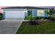 Charming single-story home with a well-manicured lawn and attached garage at 12811 Wanderlust Pl, Parrish, FL 34219