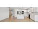 Modern open-concept kitchen with central island, stainless steel appliances and lots of space at 12811 Wanderlust Pl, Parrish, FL 34219