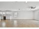 Open-concept living room featuring modern island, lots of space, and access to the kitchen at 12811 Wanderlust Pl, Parrish, FL 34219