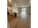 Open-concept kitchen featuring an island with stainless steel appliances and ample counter space at 2746 Pearly Banks Dr, Bradenton, FL 34208