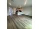 Spacious living room featuring hardwood flooring, an open layout, and recessed lighting at 2750 Pearly Banks Dr, Bradenton, FL 34208