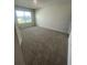 Bright bedroom with large window and carpeted floor at 2754 Pearly Banks Dr, Bradenton, FL 34208