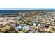 Aerial view showcases homes in the community with waterfront access, surrounded by lush landscaping at 5606 Seagrass Pl, Apollo Beach, FL 33572