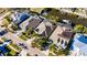 Stunning aerial view of waterfront homes, featuring lush landscaping, screened enclosures and beautiful architectural details at 5606 Seagrass Pl, Apollo Beach, FL 33572