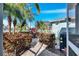 Backyard with tropical landscaping and exterior view of the house at 5606 Seagrass Pl, Apollo Beach, FL 33572