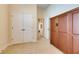 Neutral bedroom featuring a double door closet and wardrobe at 5606 Seagrass Pl, Apollo Beach, FL 33572