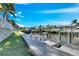 Waterfront property featuring a dock and boat lift along the canal at 5606 Seagrass Pl, Apollo Beach, FL 33572