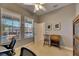Home office with view of pool area, ceiling fan, and desk at 5606 Seagrass Pl, Apollo Beach, FL 33572