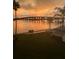 Breathtaking sunset view featuring a bridge over tranquil waters and lush green space with palm trees at 5901 Bahia Del Mar Cir # 321, St Petersburg, FL 33715