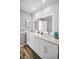 Elegant bathroom with double vanity, ample storage, and a backlit mirror at 100 Bluff View Dr # 205C, Belleair Bluffs, FL 33770
